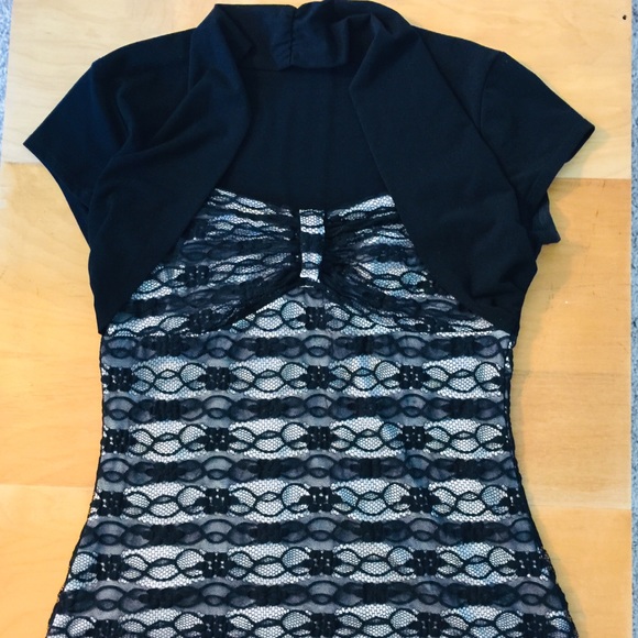 Black dress top with overlay design over white. - Picture 1 of 4